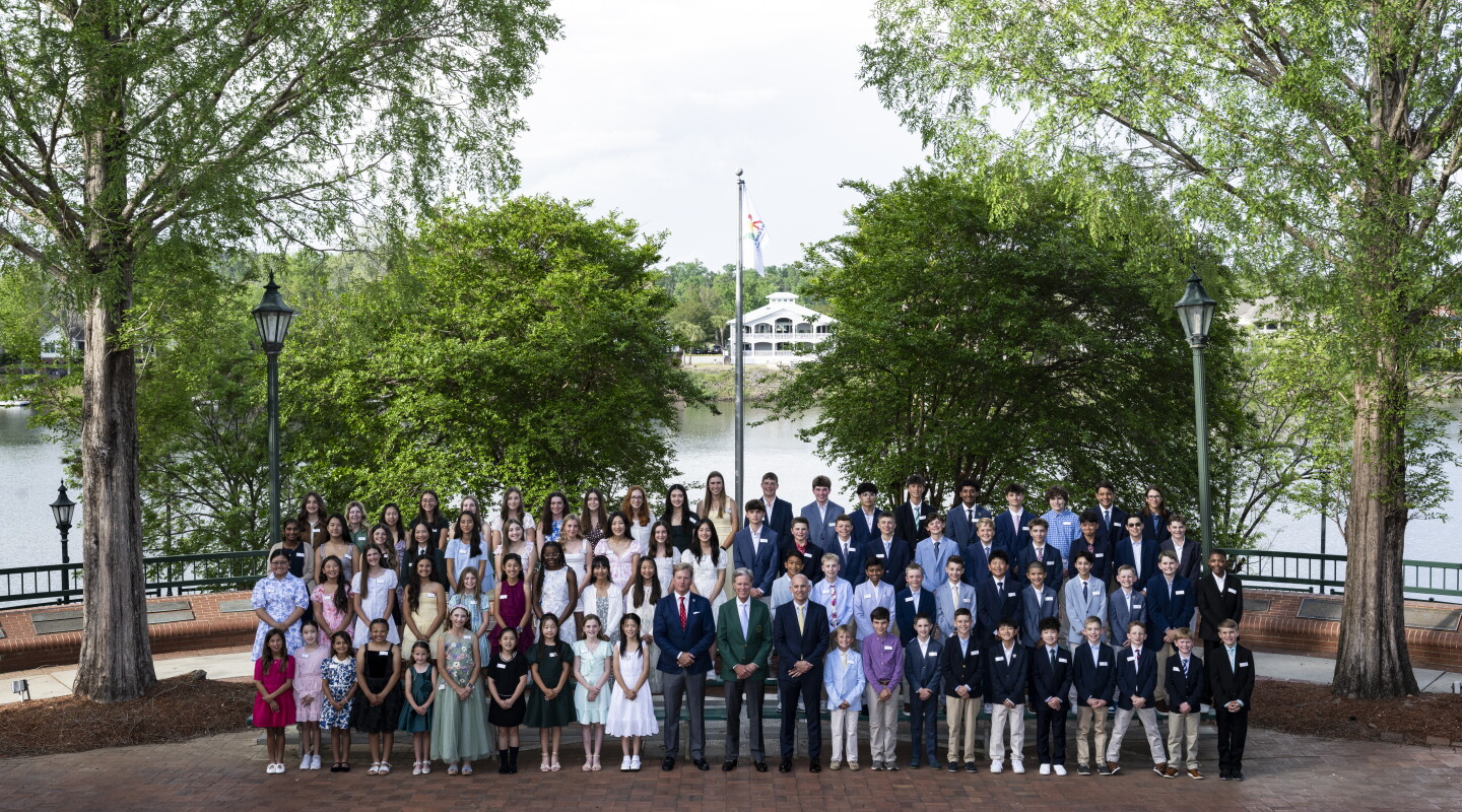 Fred S. Ridley, Chairman of Augusta National Golf and the Masters Tournament poses with participants from the 2026 Drive, Chip & Putt National Finals.